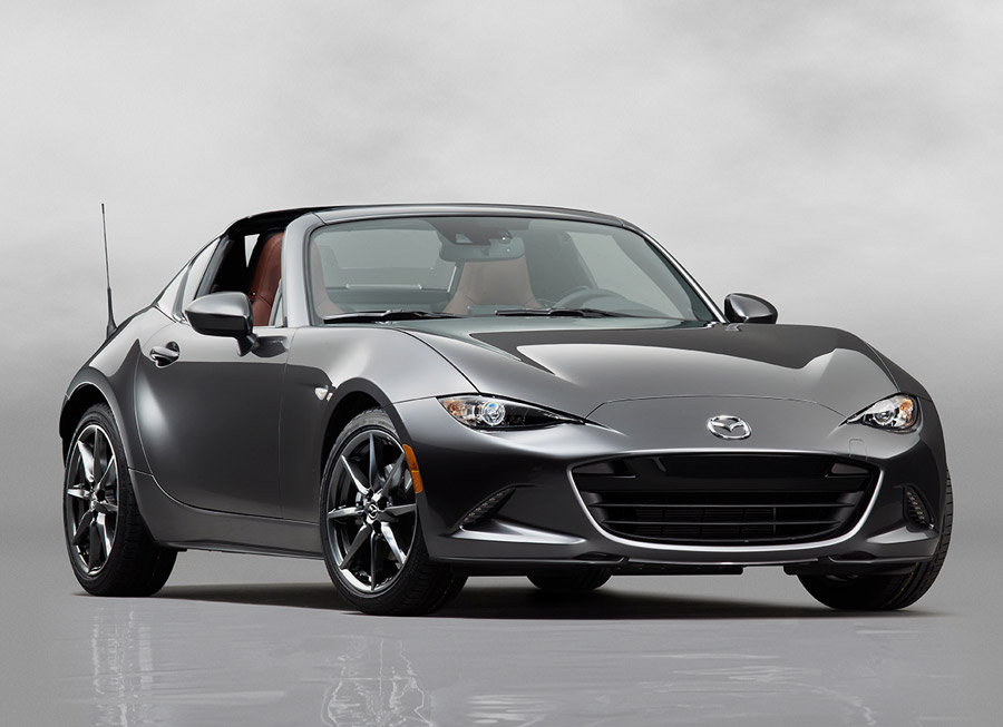 a black mazda mx-5 coupe insdie a silver background